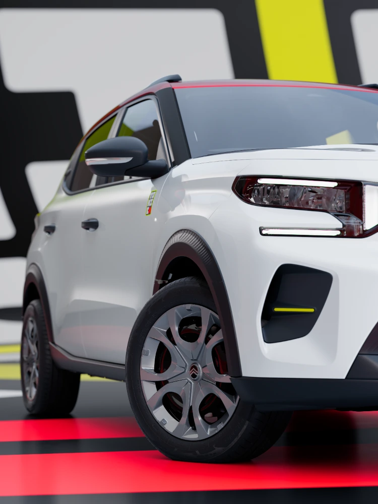 Vue avant trois‑quarts détaillée de la Citroën ë‑C3 TONIC édition limitée, soulignant le design des jantes et les protections de carrosserie, une alternative électrique futée.