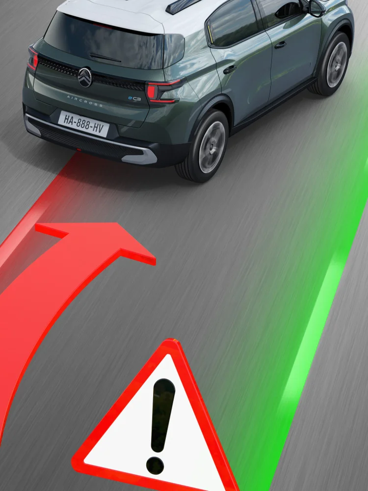 SUV Citroën affichant une alerte de sortie de voie avec des images projetées de voies rouges et vertes sur la route